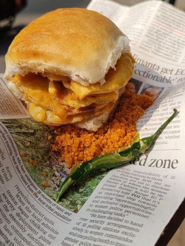 Hot Maharashtrian Vada Pav wrapped in a newspaper sheet close up